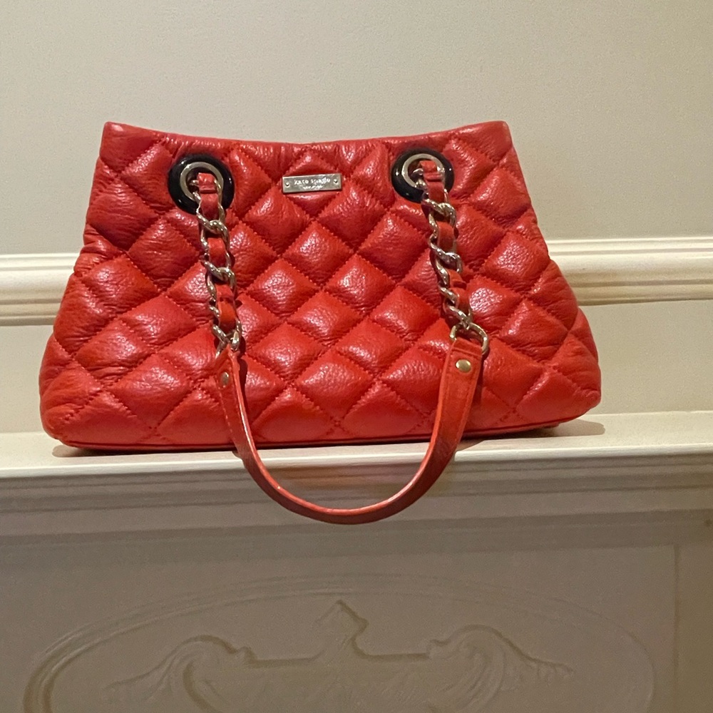 Kate Spade quilted orange purse.